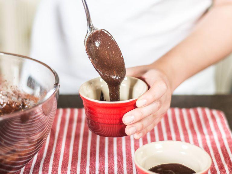 Distribute the mixture into two coffee mugs or three baking tins.