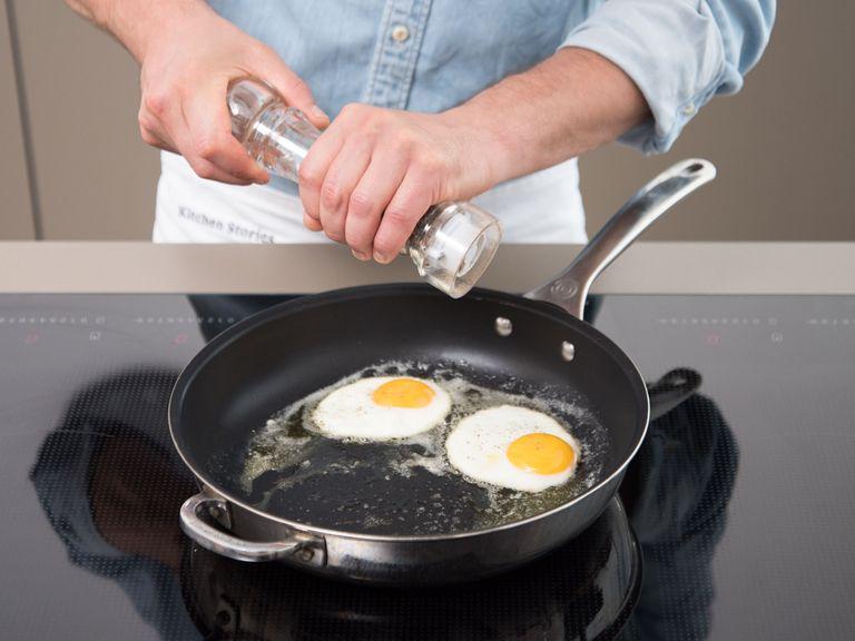 Eier aufschlagen und vorsichtig in die Pfanne geben. Bei mittlerer Hitze ca. 3 - 4 Min. braten, oder bis der gewünsche Gargrad erreicht ist. Mit Salz und Pfeffer würzen. Das Spiegelei auf dem Leberkäse mit Kartoffelsalat servieren. Falls gewünscht, mit mehr Senf servieren. Guten Appetit!