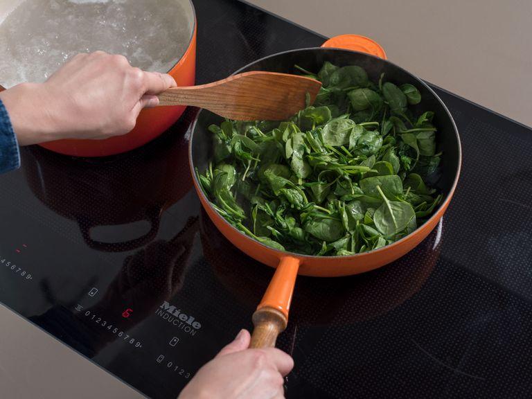 In the meantime, heat a large frying pan over medium heat and allow the spinach to wilt in portions. Place the cooked spinach in a sieve and squeeze it lightly, then chop coarsely.