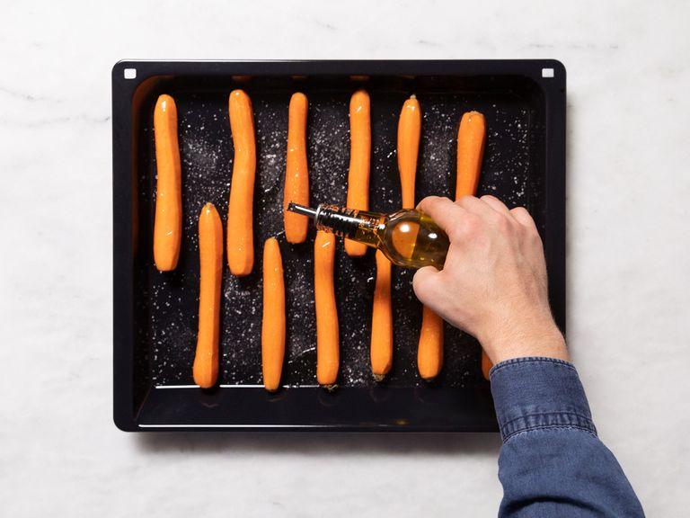 Backofen auf 180°C vorheizen. Karotten schälen und auf ein Backblech geben. Mit etwas Olivenöl beträufeln, salzen und anschließend für ca. 45 Min. im Backofen garen.
