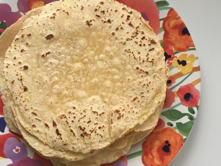 repeat step six with all the tortillas. Let cool for a few minutes then place in a plastic bag or tupper while still warm. This will keep the humidity in your tortillas until serving time. Serve and enjoy!