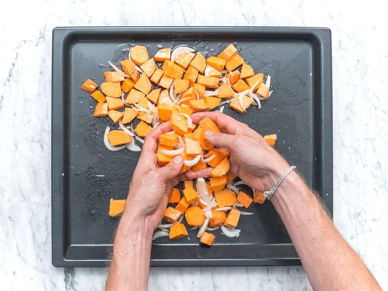 Add sliced sweet potato, onion, shredded coconut, melted coconut oil, garlic, sea salt, and pepper to a baking sheet and toss to coat. Bake at 210°C/410°F for approx. 20 min. Then remove from the oven and let cool down a bit.