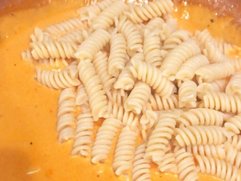 drain pasta when it is finished cooking, add directly to sauce and mix.