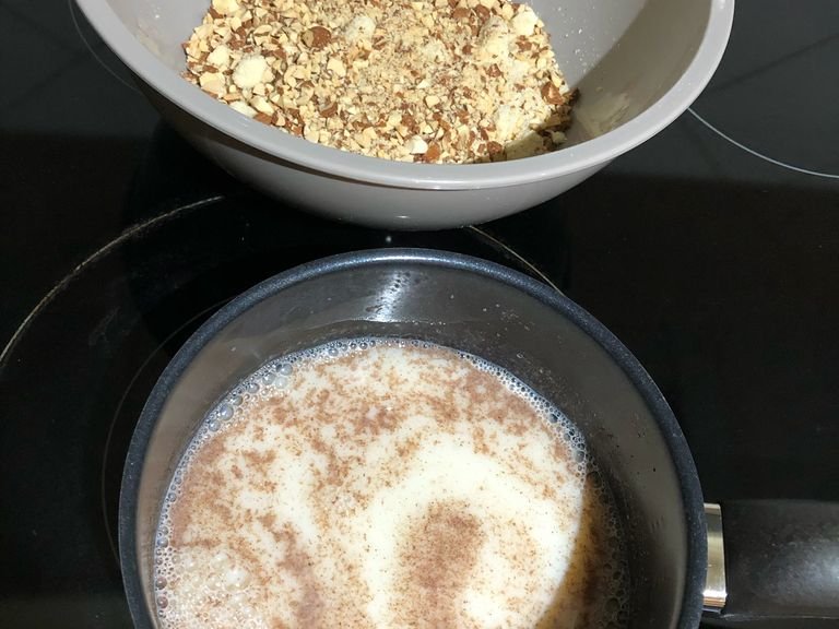 In the meantime, prepare the filling: warm up the milk and dissolve sugar and cinnamon. Chop the almonds and combine with almond meal. Pour milk over almond mix and stir to combine. Place into fridge until dough is ready.