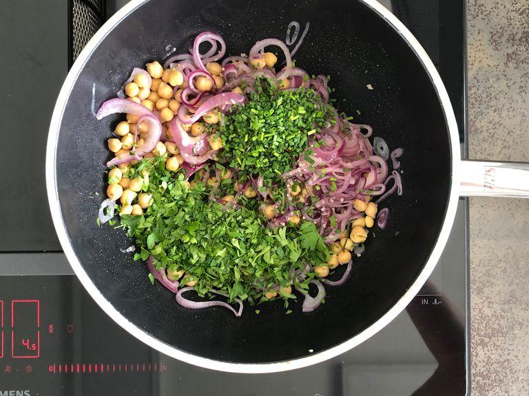 Meanwhile, add chickpeas, bacon and chopped herbs to the onions. Stir well and let cook through on low heat.