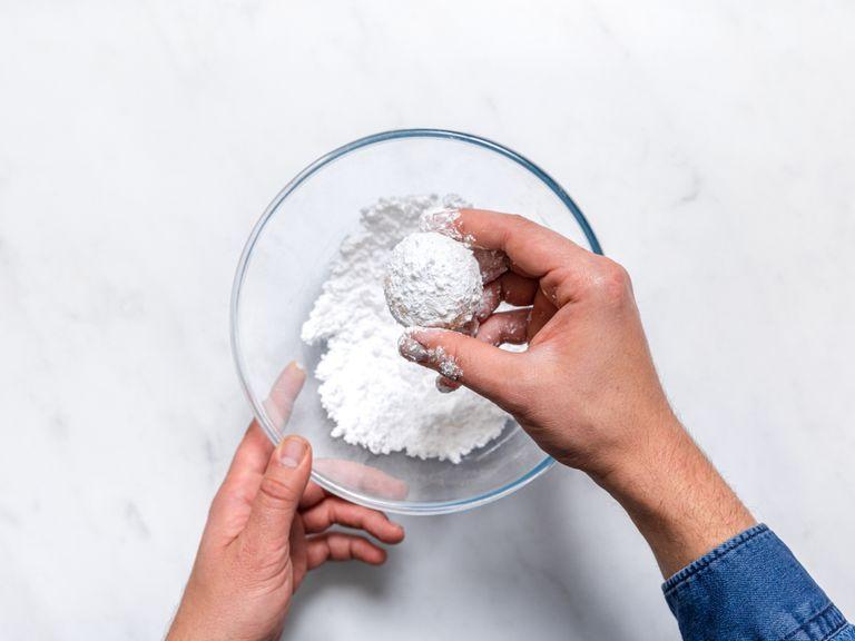 Meanwhile, sift remaining confectioner’s sugar into a bowl. Roll the warm cookies in it until fully coated. Let the coated cookies cool for 5 min., then roll them in the sugar once again. Enjoy!