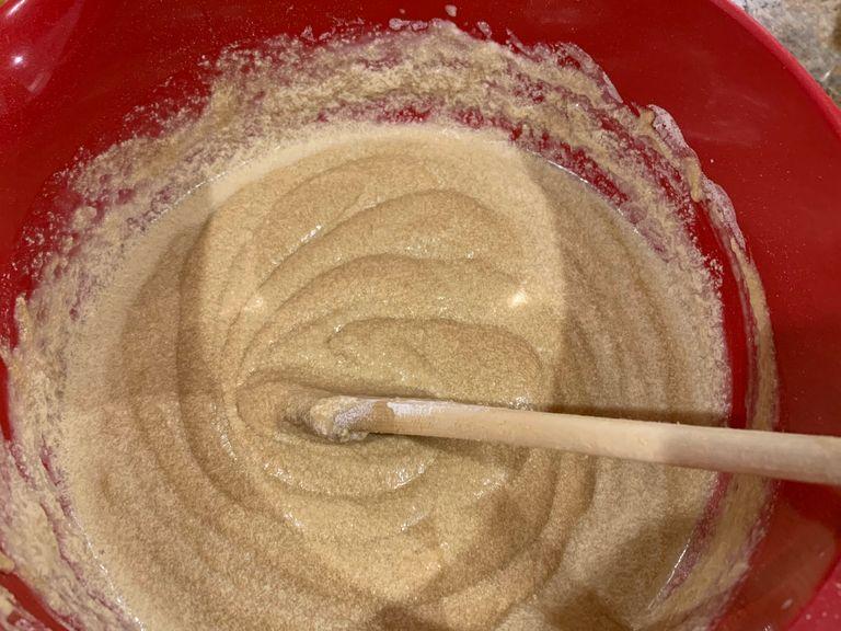 alternate between adding a bit of flour (mix) then a bit of milk (mix). Add until all used up.