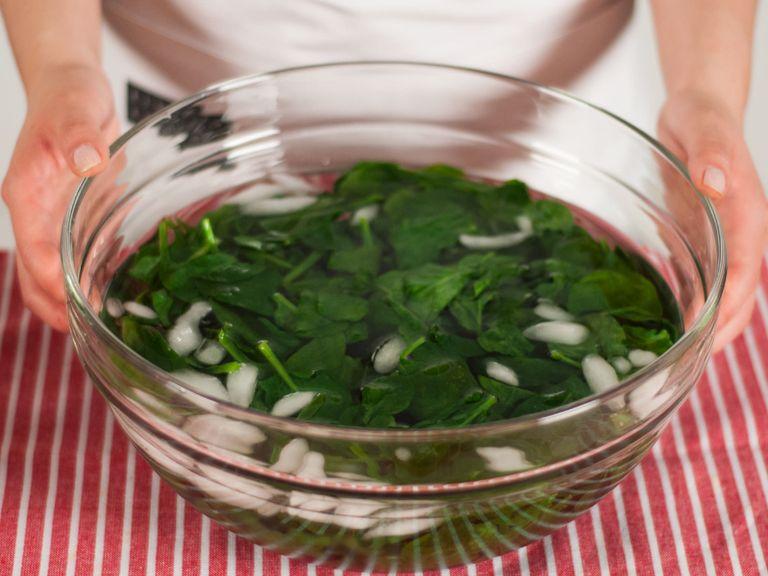 Transfer spinach to an ice bath and allow to cool for approx. 5 – 6 min. Then, remove spinach from water and squeeze out any extra liquid. Set aside.
