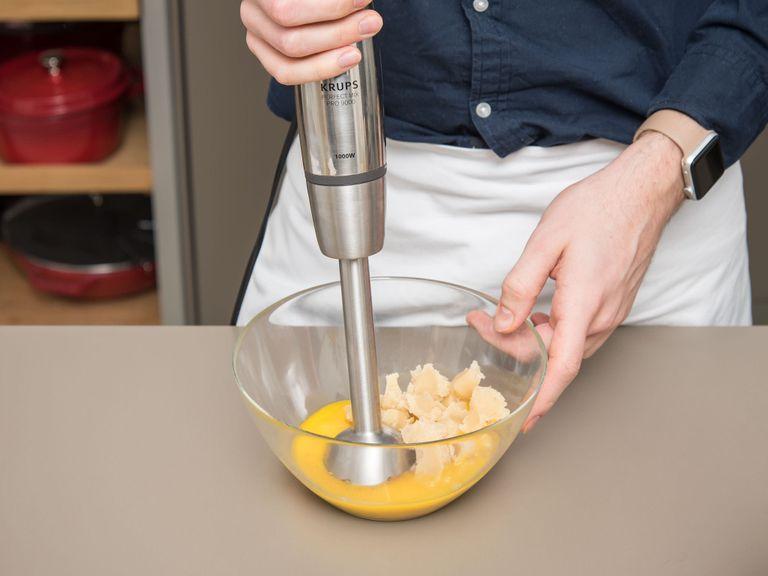 In a large bowl mix flour, ground hazelnuts, and baking powder and set aside. Add almond paste, egg yolks, and cinnamon to a separate large bowl and blend with an immersion blender until smooth. With a standing hand mixer continuously beat until the mixture turns lighter in color. Set aside.