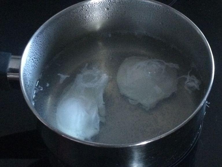 Bring water to a boil and add the white wine vinegar. Give the water a swirl while lowering the heat until barely simmering and then add the eggs to poach for around 3 minutes