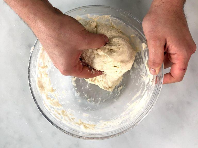 Add flour and water to a large bowl and knead well to combine. Cover and let the dough rest for approx. 1 hr.