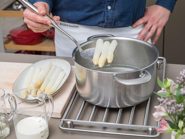 Remove asparagus from the pot and reserve the cooking liquid. Once cool enough to handle, slice the asparagus, and set aside the heads.