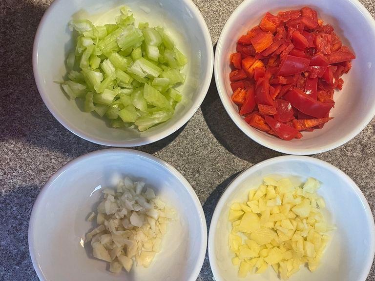 Deseed the chillies and chop finely, after this is done don't forget to wash your hands. Next finely chop the Garlic, Ginger and 1/2 head of celery and place into different pots as shown