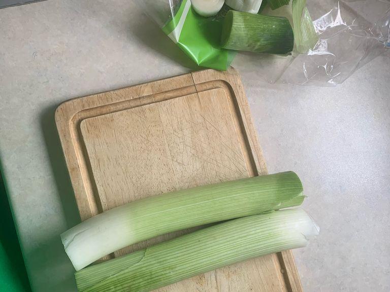Chop off the top and bottom of your leeks