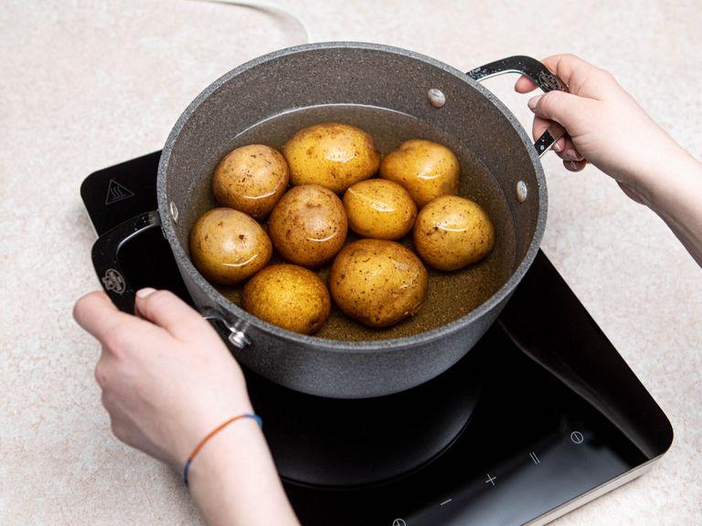 Add potatoes into a pot with salted boiling water and cook until soft. Drain them and let cool.