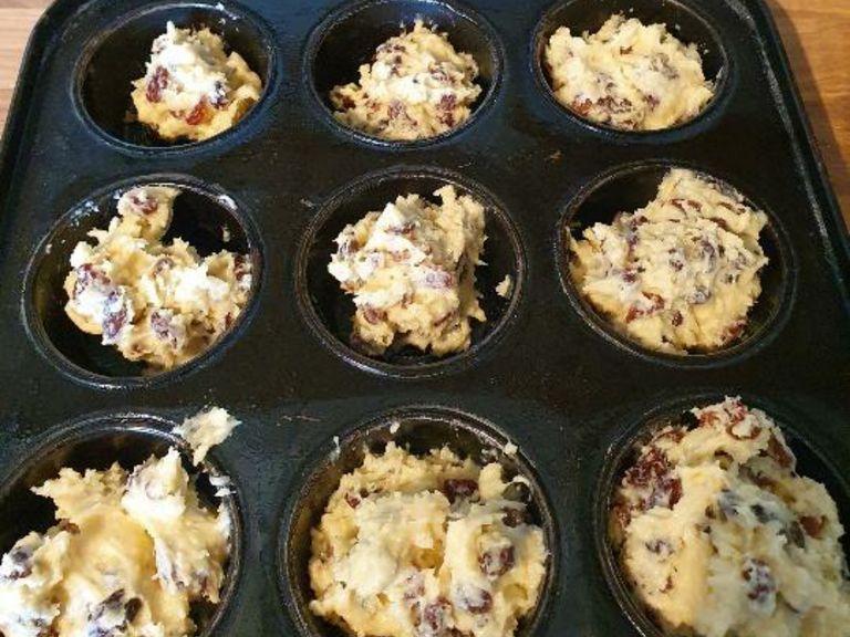 Grease a muffin tin with a non stick cooking tray or with butter. Place pieces of of dough in the muffin tray. Make sure to ore hear the oven 180°C/350°F gas mark 4. bake for 15-25 minutes.