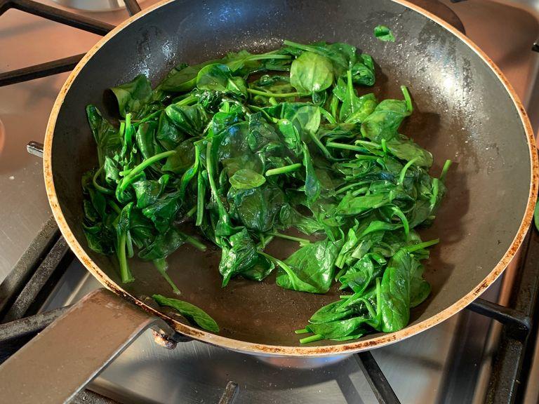 Melt the butter in a frying pan over a medium heat and then add the spinach and the grated nutmeg. Cook until wilted
