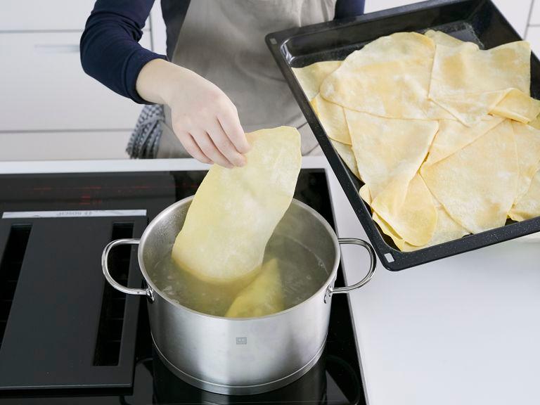 Bring a large pot of water to a boil. Season with plenty of salt and cook lasagna until al dente. Drain and let cool on a big surface, tossing with some vegetable oil so the sheets don't stick together.