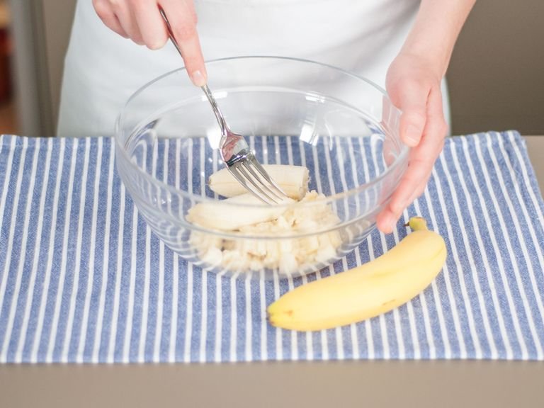 Peel some of the bananas. Use a fork to mash in a bowl.