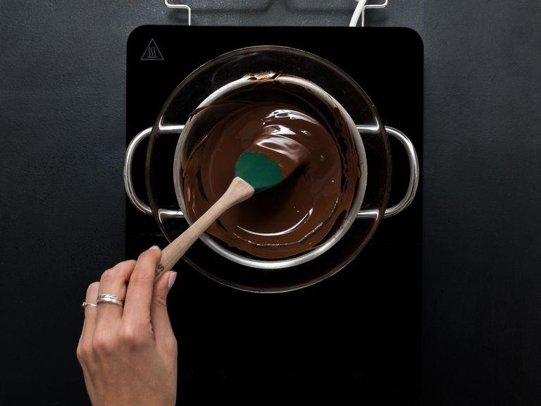 Roughly chop chocolate, add to a heatproof bowl, and place on top of a pot filled with simmering water to make a double boiler. Stir gently until melted.
