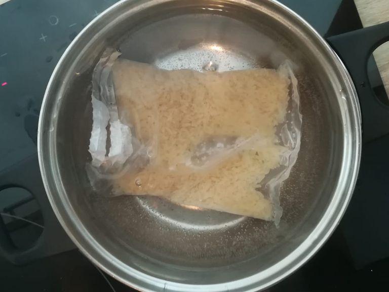 Put a bag of rice in a boiling water. Cook for about 15min.