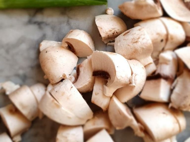 Chop mushrooms however you prefer. I use bite size chunks, remember they will shrink a little with cooking. Stir them in.