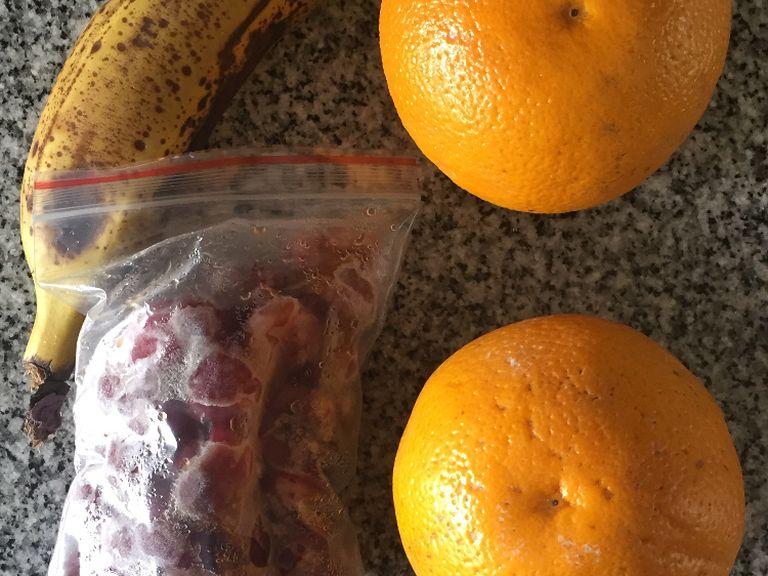 gather all ingredients. Wash and peel banana, core cherries and squeeze orange.