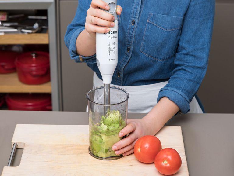Using a spoon, add avocado flesh to a liquid measuring cup and puree using an immersion blender. Quarter the tomatoes, remove the seeds and chop into small dice. Juice the lime and add to the avocado along with olive oil, sugar, salt, and chili flakes. Stir the tomatoes through the blended guacamole. Chop cilantro and set aside.