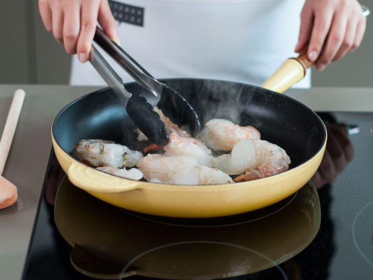 Sauté shrimp and garlic in some vegetable oil at medium-high heat for approx. 1 - 2 min. on each side. Remove from heat.