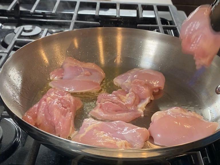 Get the pan nicely hot with olive oil in medium or lower medium heat and put the chicken, and leave it for 2 - 4 mins