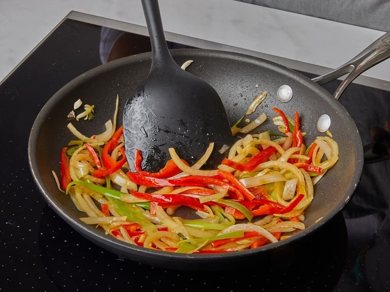 Heat some oil in a nonstick frying pan, then add onion and whites parts of scallion and fry for approx. 1 min. or until fragrant. Add bell pepper and fry for approx. 2 min. Remove vegetables and let cool for approx. 5 min.  Once the vegetables are about room temperature, mix with beaten egg.