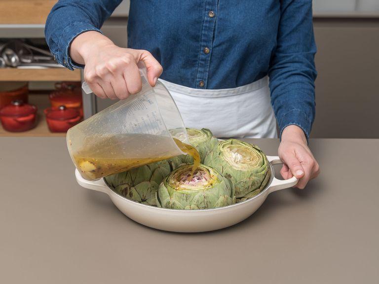 Uncover and bake for approx. 10 – 15 more min., or until until well-browned and tender, periodically basting the artichokes with their juices during baking. Let cool slightly before serving along with pan juices. Enjoy!