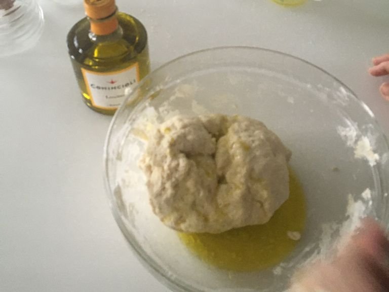 Put the dough back into the bowl and add your olive oil to the mixture