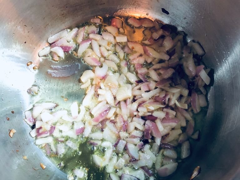 Heat the olive oil in a large saucepan. Add chopped onion and sauté until translucent.
