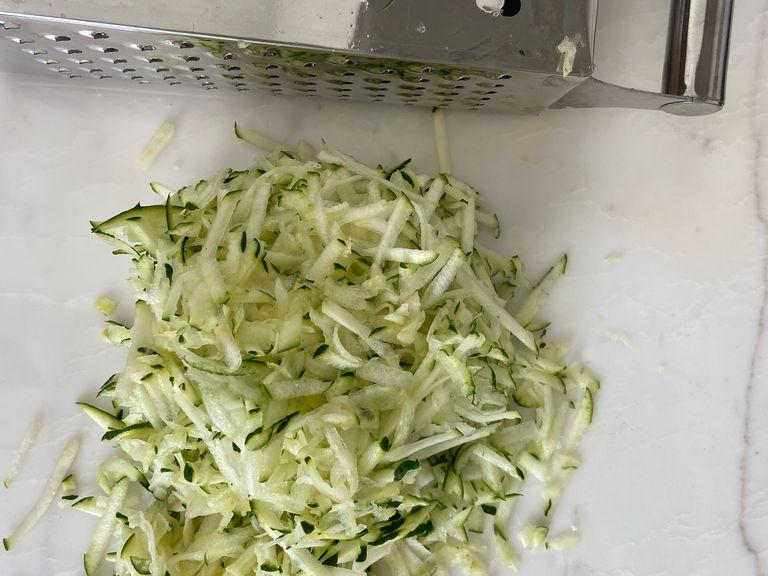 Sprinkle of salt and allow to sit for about 10 min until salt has drawn out the water from zucchini.