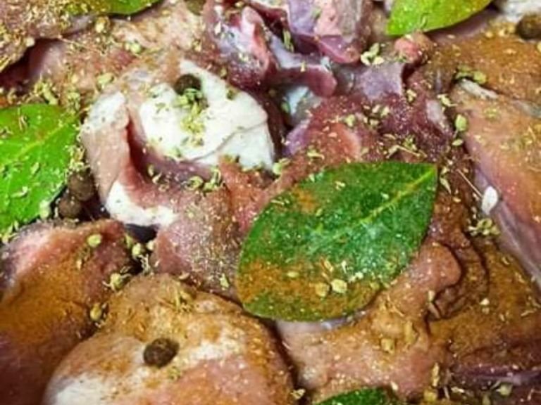 Add the pork, the onions, the bay leaves, the all spice berries in the cooking pot. Also add salt, pepper, oregano, paprika and the olive oil for and let it cook in high temperature for about 5 minutes.