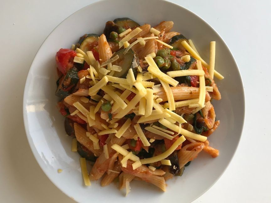 Pasta with vegetables in olive oil & tomato-based sauce