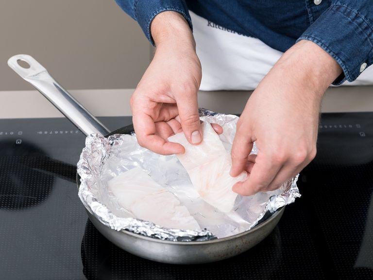 Line a pan with aluminum foil. Make several holes in the foil with a fork, then add another layer of foil and make more holes. Add water to the pan and bring to a boil, making sure it’s high enough to cover the fish fillets. Poach the fish for approx. 2 min. or until cooked through.