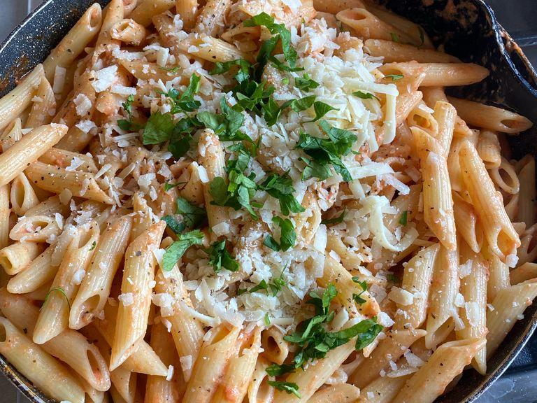 Add the drained pasta, water from pasta, more salt and pepper, Parmesan Cheese and fresh chopped parsley.