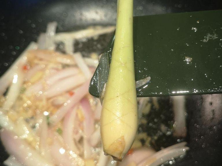 I like to score my lemongrass to get the maximum flavour out, you can cut 'X' shapes onto it without cuting all the way through. don't forget to add your Kafir lime leaf!