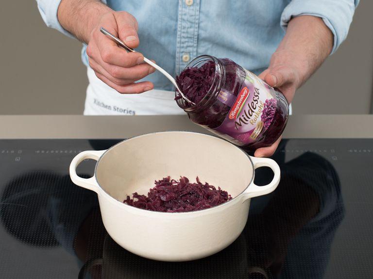 Add red cabbage to a large saucepan and season with juniper berries, cloves, and bay leaves. Warm over medium heat for approx. 8 – 10 min., then keep warm over low heat until serving.