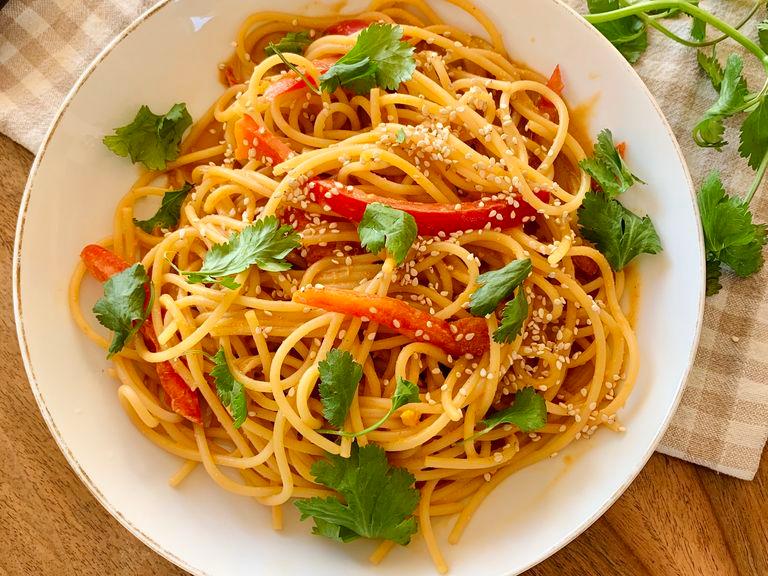 Toss noodles with sesame peanut butter sauce and vegetables. Serve with fresh cilantro and sesame seeds. Enjoy!