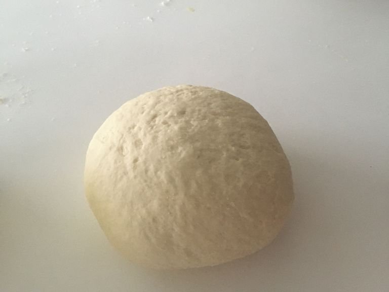 Knead the dough until you get a nice circular shape, with a sticky but firm consistency