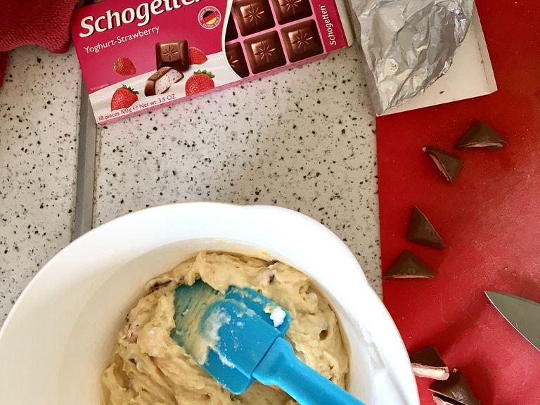 Whisk the flour into the creamed mixture, then carefully fold in the egg white trying to keep as much air as possible. Chop the schogetten squares, or any chocolate you are using, and fold into the batter. You can mix all of the chocolate in batter or keep some for decorating the top.