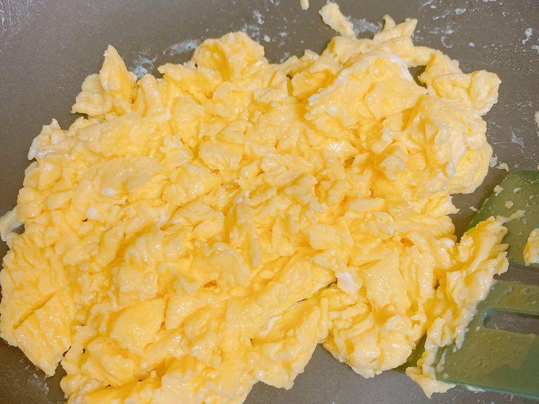 Heat half of the oil and scramble the egg until it’s fully cooked. Pour it into a separate bowl.