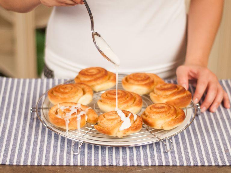Place a plate underneath the cake rack to catch any excess frosting. Drizzle cinnamon buns with sugar frosting to your liking.  Serve while still warm.
