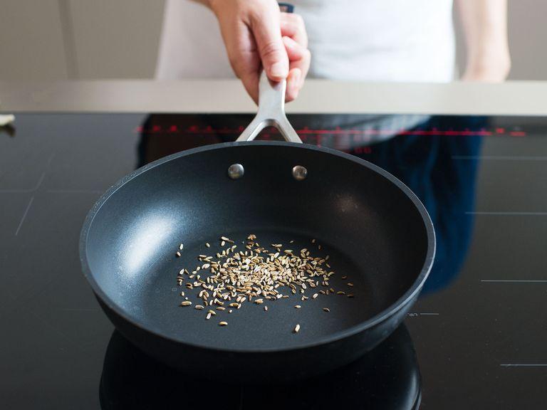 Toast the fennel seeds in a frying pan over medium heat until fragrant. Set aside to cool slightly. Zest and juice the lemon and set aside. Drain and rinse the white beans.
