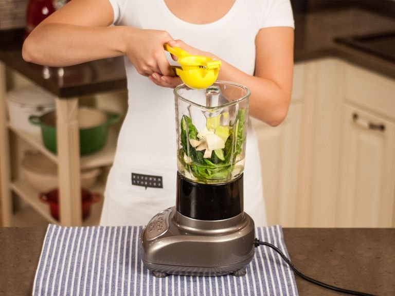 Add all chopped vegetables and fruits to a blender. Add agave syrup, flaxseed oil, lemon juice, and water.