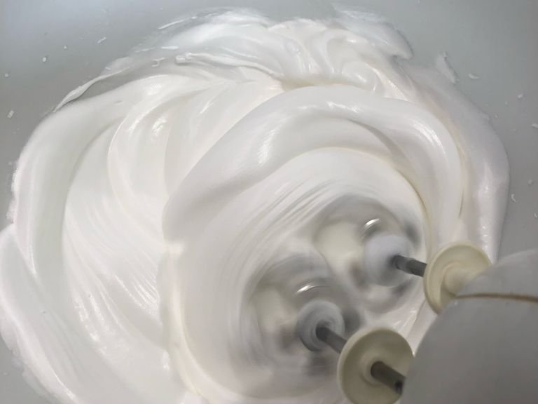 Make meringue-beat egg white and slowly add sugar in 3 stages.  Beat until firm peak ￼