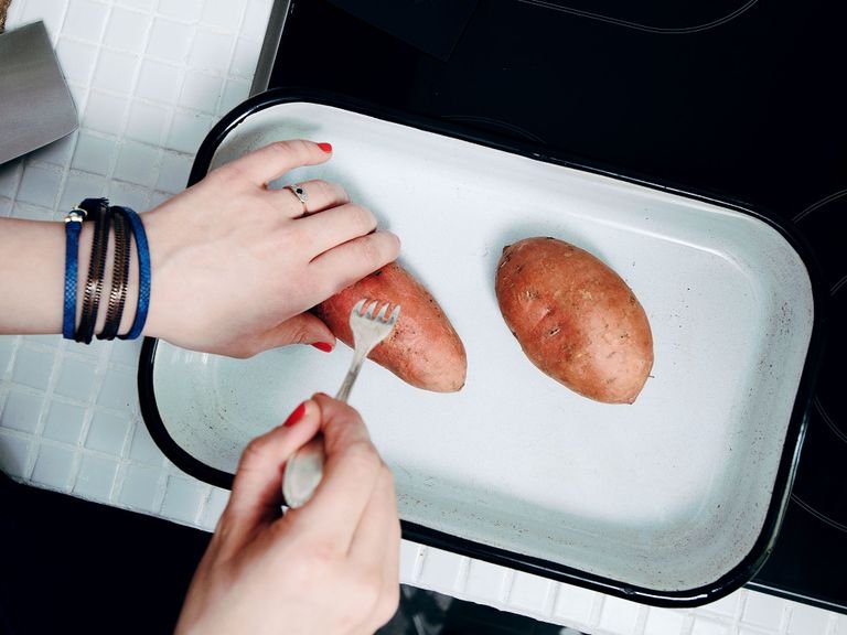Preheat oven to 200°C/400°F. Place sweet potatoes in a baking tray and pierce skin approx. 8 times with a fork. Transfer to oven and bake for approx. 35 min.